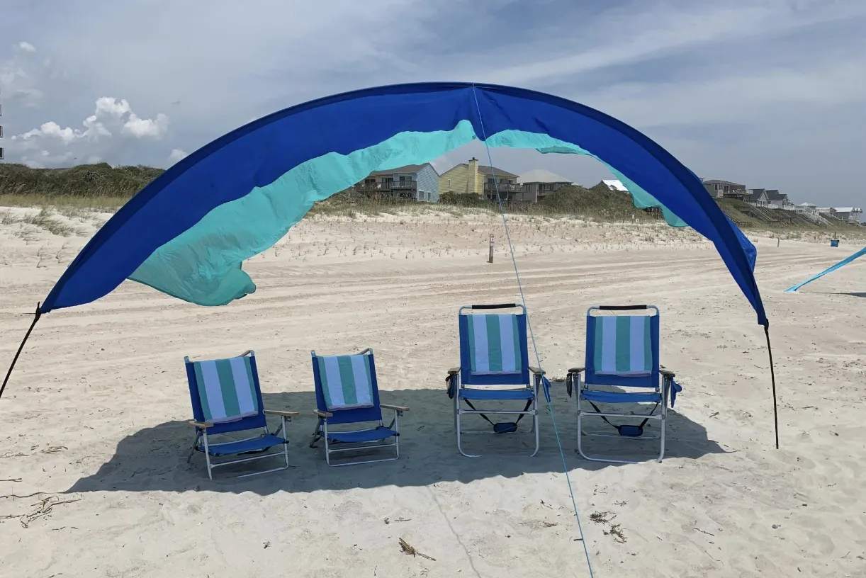 A display of beach gear, including chairs, umbrellas, and sunshades at our Emerald Isle store.